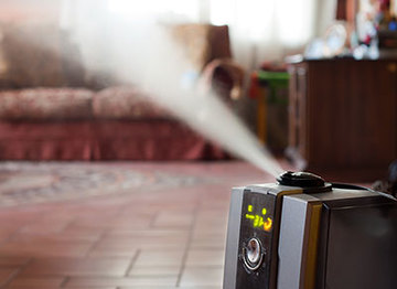 Humidifier on the floor of a living room