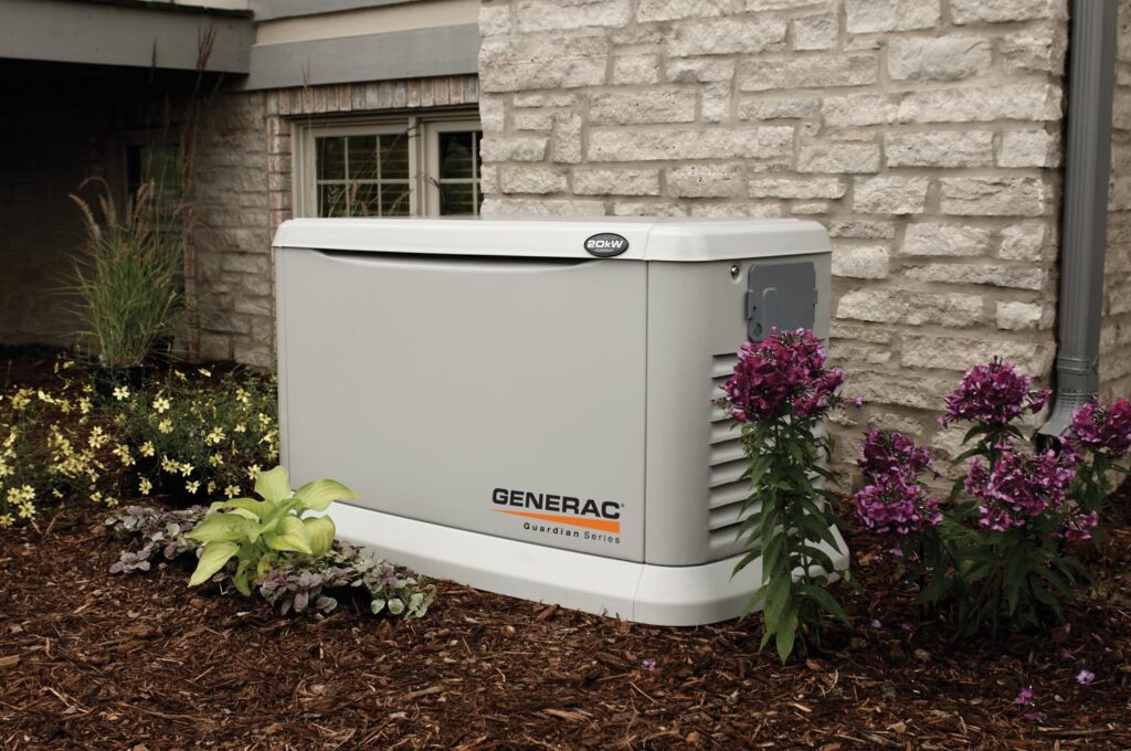 New Generac generator installed next to a white brick home.